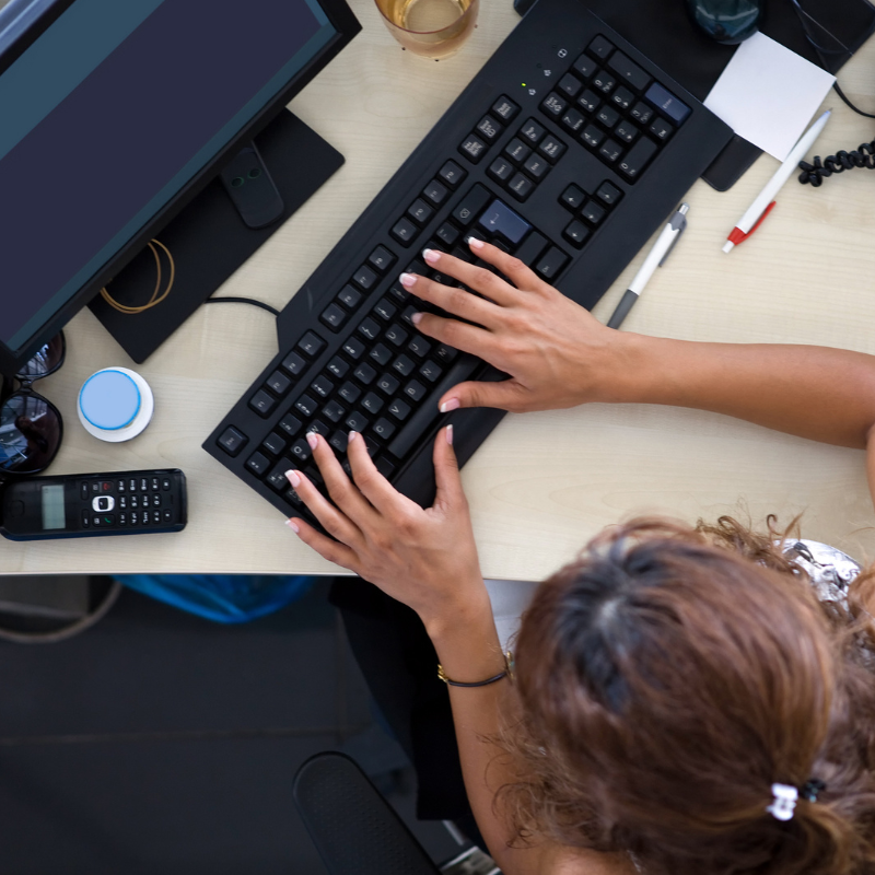 legal secretary typing on computer